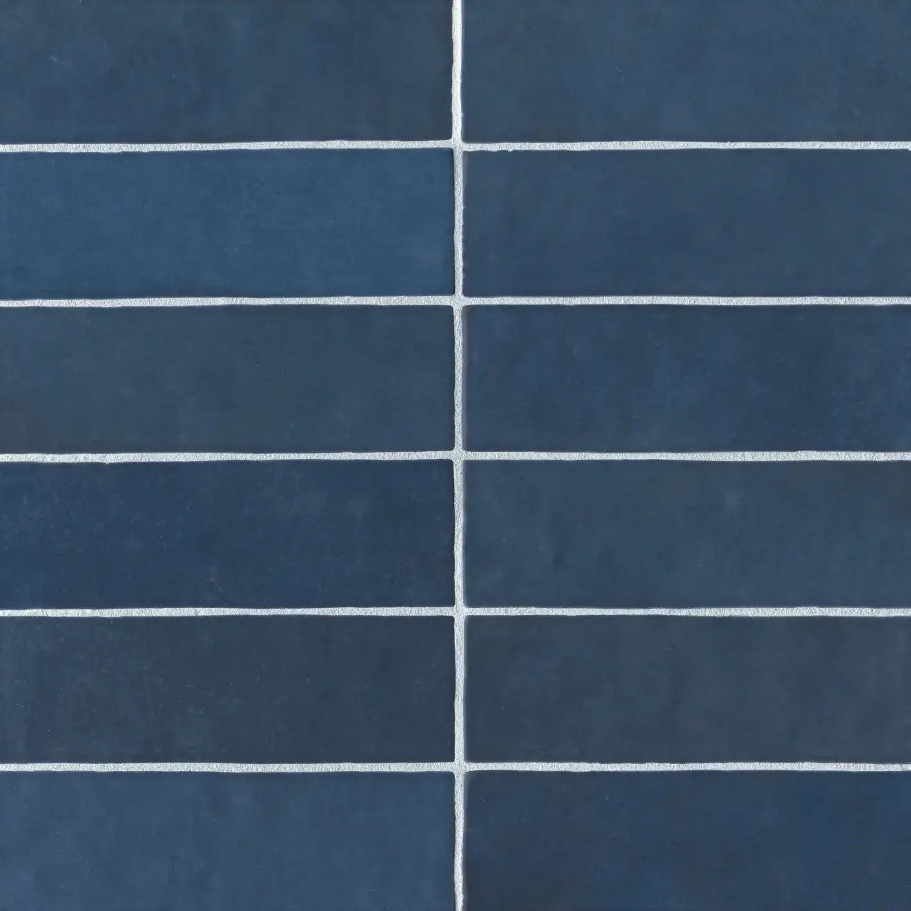 Cloé 2.5" x 8" glossy ceramic tile in deep blue with a sleek rectangular design.