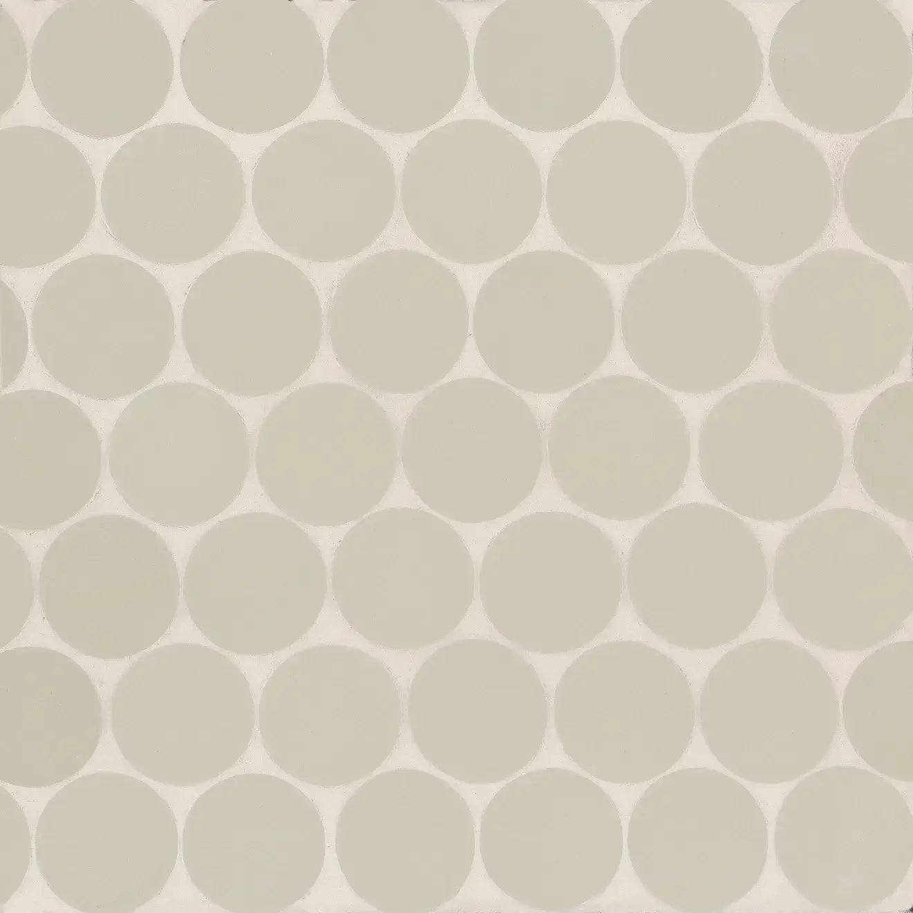 Makoto 2" round matte porcelain mosaic tile in Kumo Grey, ideal for elegant designs on walls and floors.