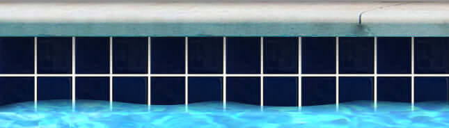 Royal blue mosaic tile pool border with white grout, perfect for luxurious swimming pool designs.