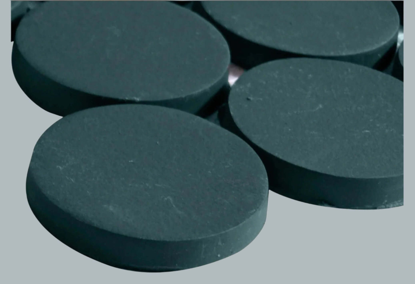 Makoto 2" round matte porcelain mosaic tile in Midori Green, showcasing a sleek and modern design.