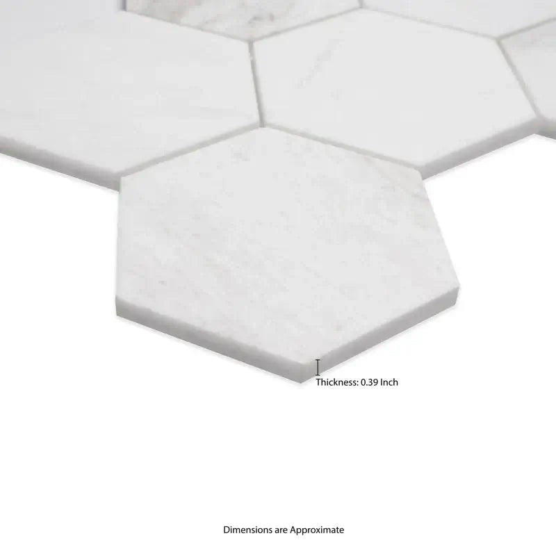 Close-up of 5” Arabescato Venato white hexagon marble tiles, showcasing thickness of 0.39 inch and elegant surface detail.
