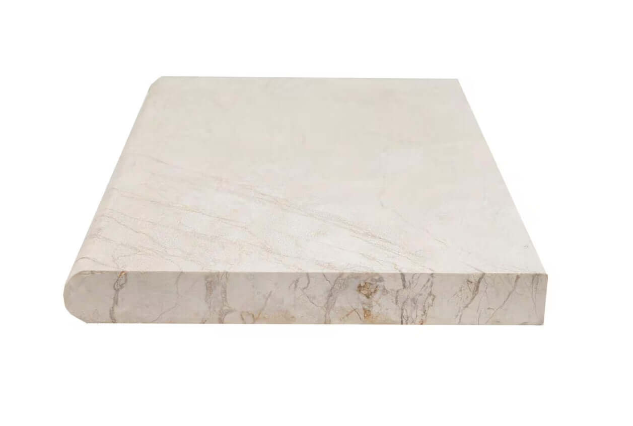 Aegean Pearl 16"x24" marble coping with tumbled edges, warm beige with soft tonal variations for outdoor design.