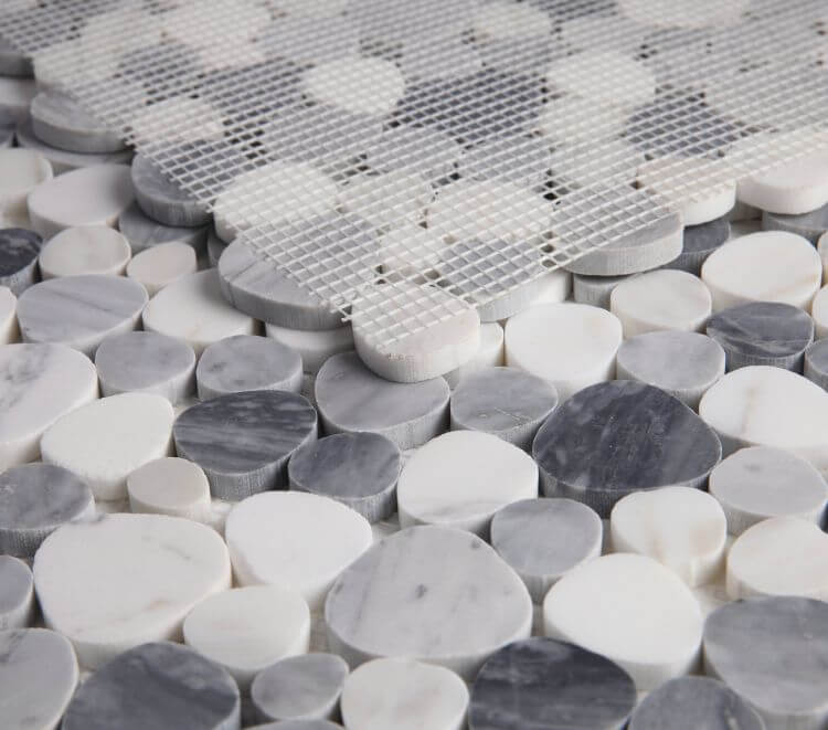 Aphrodite Calacatta Grey mosaic tiles featuring a pebble design in grey and white marble, perfect for elegant decor.