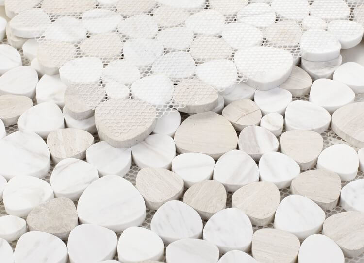 Aphrodite Loft mosaics featuring premium Volakas White and Haisa marble in heart shapes, displaying natural veining and polished finish.