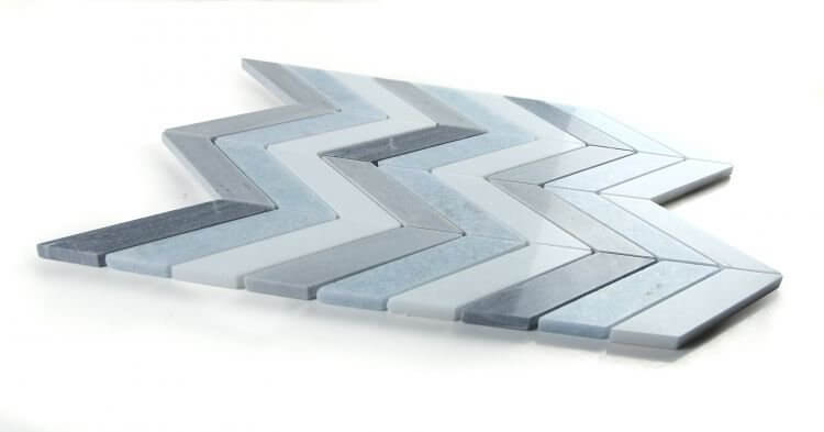 Chevron Deep Ocean Marble Mosaic tile in blue, white, and grey, showcasing a dynamic chevron pattern, 10.75 x 12.25.