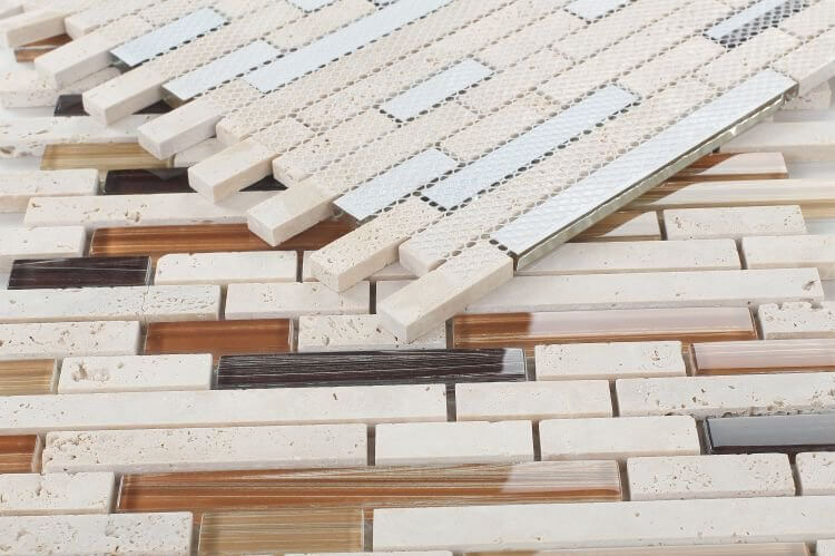 Helios Stack mosaic tiles showcasing travertine and hand-printed art glass in beige and brown, offset layout for modern decor.
