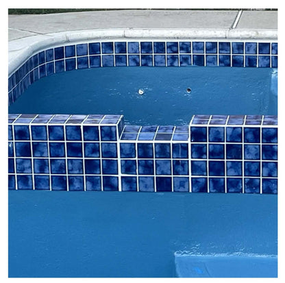 Close-up of Marble Blue pool-rated mosaic tiles in a swimming pool, showcasing elegant design and color.