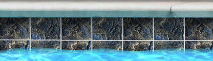 Fujiwa Java Series Oregon Blue porcelain pool tile at waterline, showcasing its deep blue hues and elegant design.