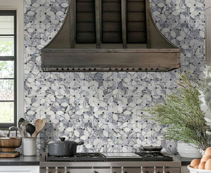 Calacatta Violet Lilac Cecily Pattern Mosaic Tile backsplash in a modern kitchen featuring a stylish hood.