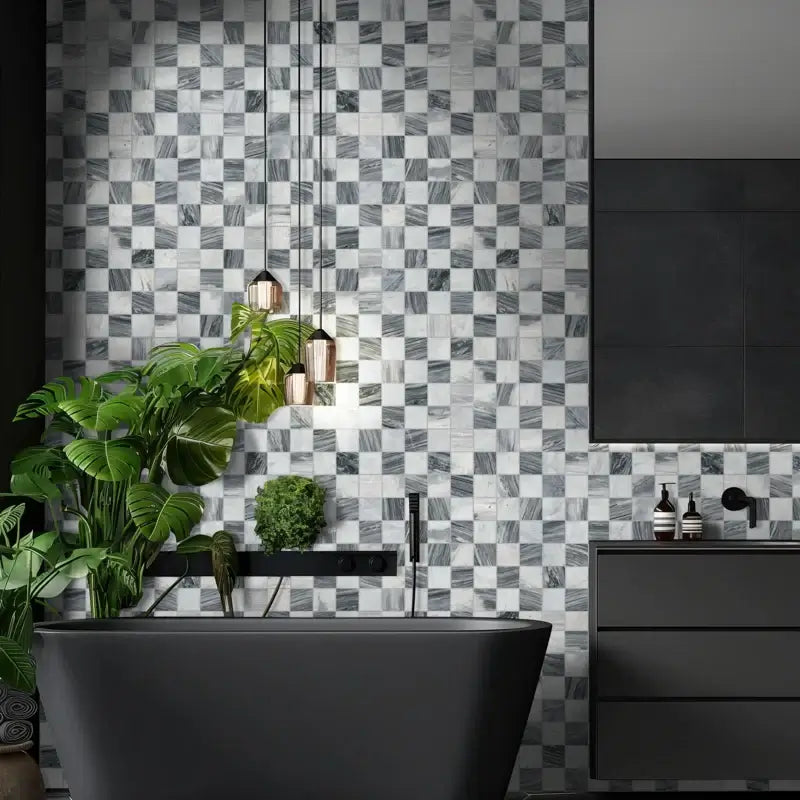 Modern bathroom featuring 3x3 Bardiglio Gray Carrara blend polished marble mosaic wall and sleek black fixtures.