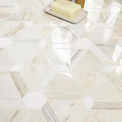 Hexagonal marble tile flooring with a polished finish and soft lighting, showcasing elegant design and texture.