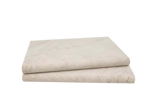 Aegean Pearl marble coping slabs in warm beige tones, showcasing a tumbled finish for elegant outdoor design.