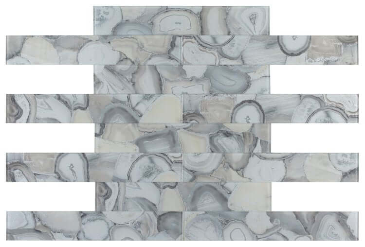 Aura Shell Grey 4x24 glass tile mosaic featuring elegant grey and white patterns, ideal for indoor wall installations.