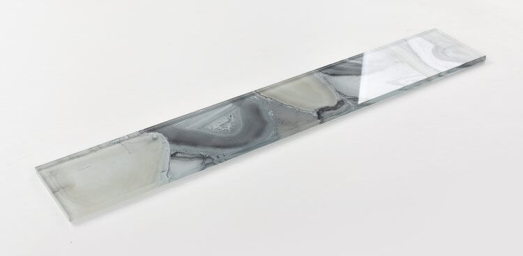 Aura Shell Grey glass tile in 4x24 size, featuring a sleek, modern design with grey tones.