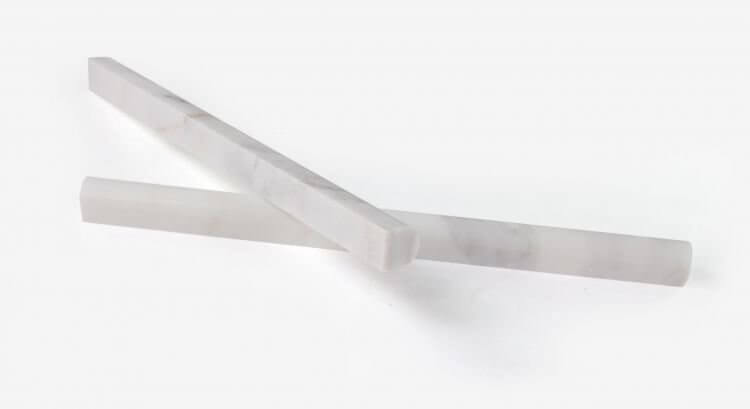 Calacatta Gold honed marble pencil trim pieces, white and gold, 0.75 x 12 inches, ideal for mosaics and decorative applications.