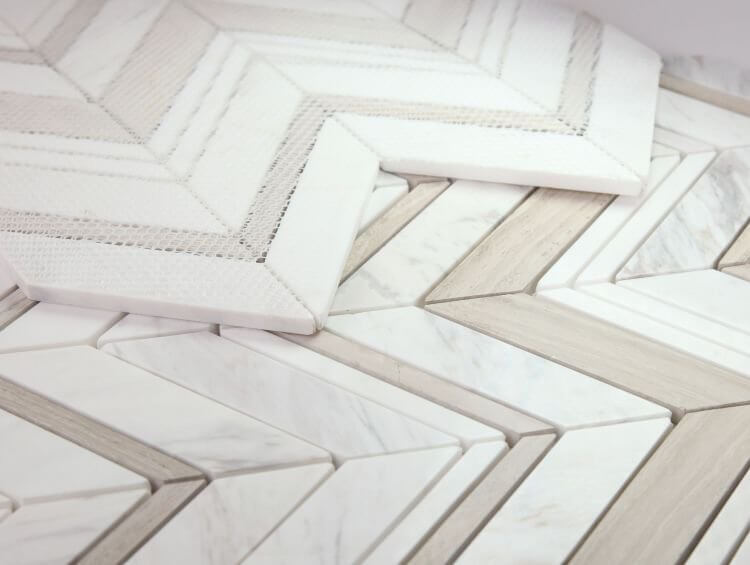 Chevron Ravenna Loft marble mosaic featuring Haisa Grey and Volakas White in a stylish pattern, perfect for modern interiors.