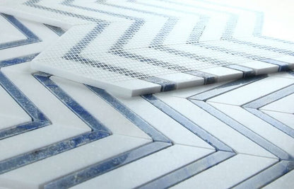 Chevron Royal Sapphire mosaic tile in blue and white, featuring a stylish herringbone pattern, perfect for elegant spaces.