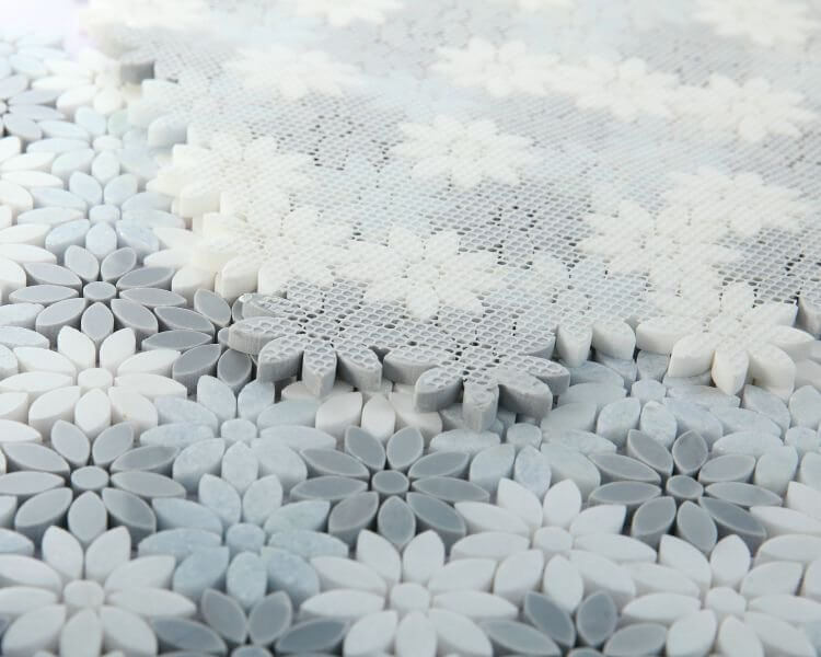 Daisy Crystal Ocean mosaic tile featuring blue crystal, grey and Thassos marble flowers.