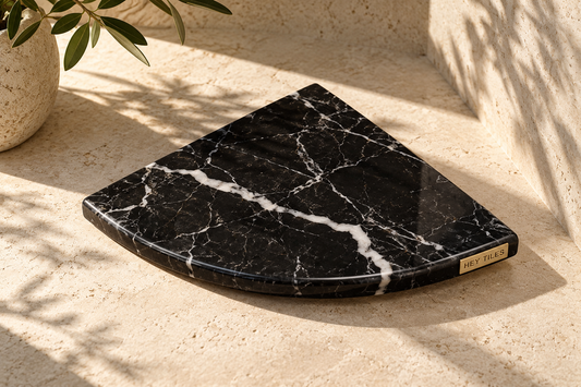 Nero Marquina marble corner shelf, Hey Tiles brass branding, artistic view 1