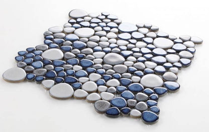 Poseidon Sky 11.5x11.5 pebble mosaic tile featuring a blend of gray and blue porcelain pebbles for a modern aesthetic.